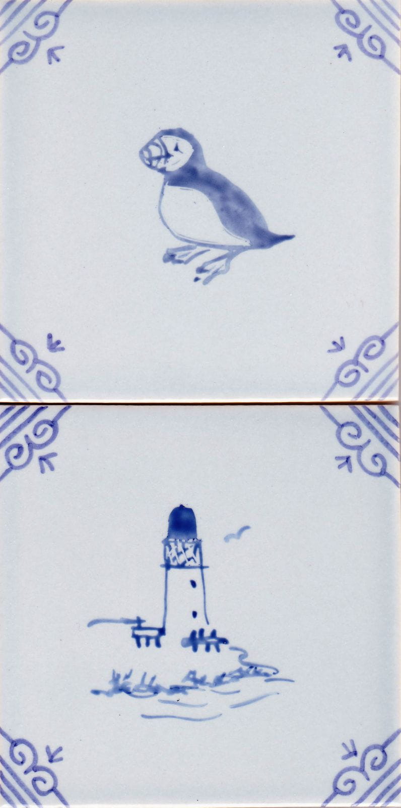 Hand painted motifs onto delft style blue tiles