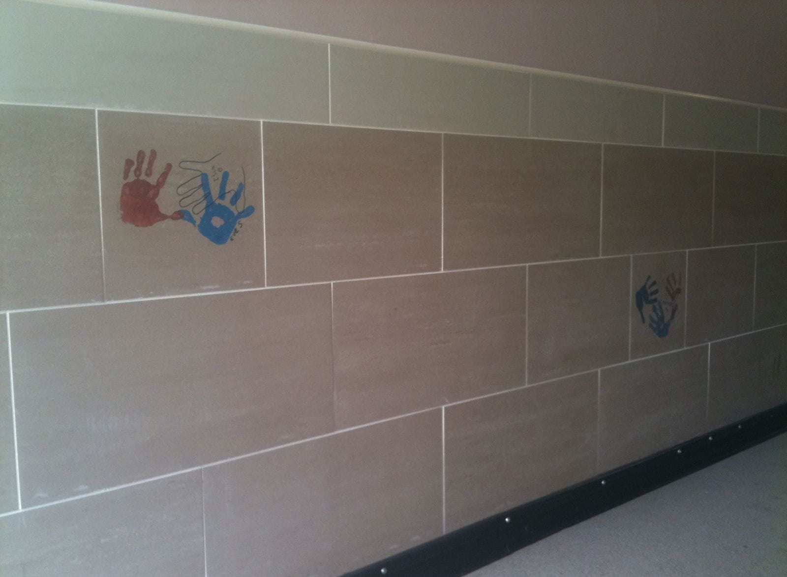 The tiles were fixed into new closes/blocks of flats built by Sanctuary Housing
