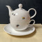 combined tea pot with cup and saucer