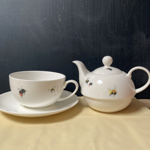 combined tea pot with cup and saucer