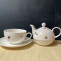 combined tea pot with cup and saucer